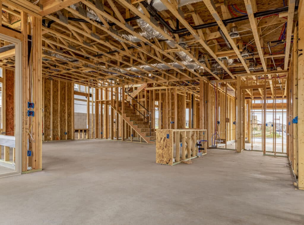 Interior view of a new house under construction with an open layout